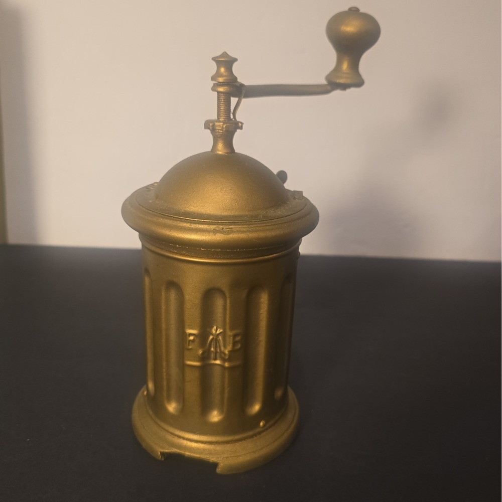 Antique F&B Tre Spade hand-crank coffee grinder with embossed three-spade logo.